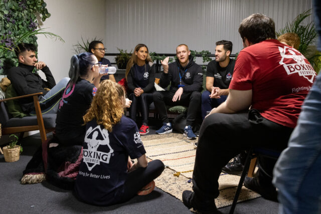 Young people talking with coaches