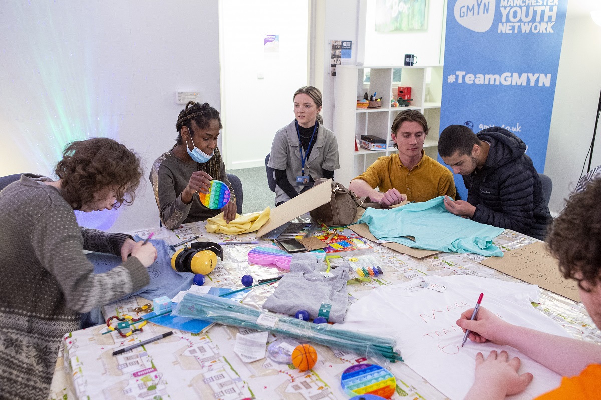 Young people making placards and t-shirts