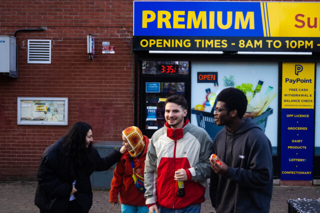 Young people in front of shop