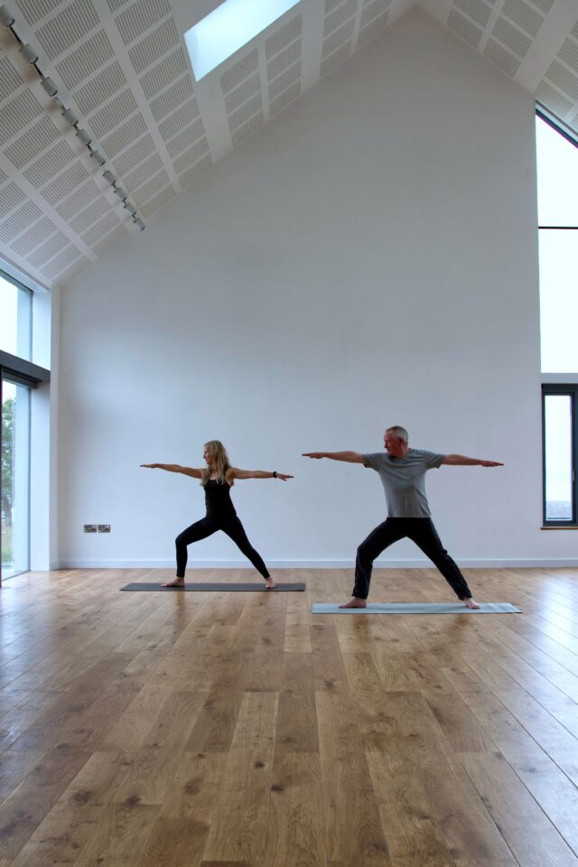 People stretching inside Iona Hall