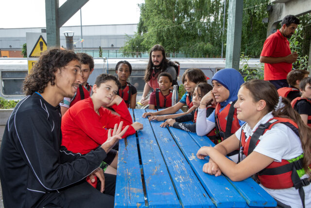 Young people talking around a table