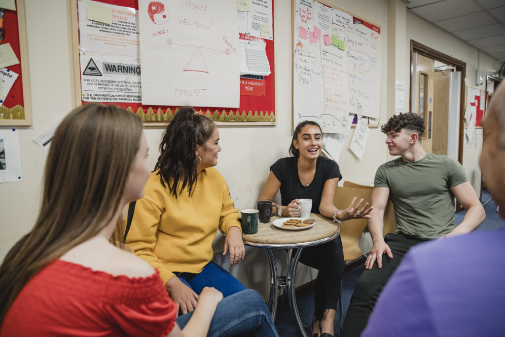group of diverse young people interacting in community